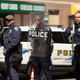 BALTIMORE, MD - MAY 4: Police form a line to block North Ave., near the site of recent riots and several blocks away from where Freddie Gray was arrested last month, May 4, 2015 in Baltimore, Maryland. Initial reports that a man had been shot by police sparked anger in the crowd. Officials later reported that no one had been injured and the gun, carried by a man seen on a security camera, had discharged accidentally.